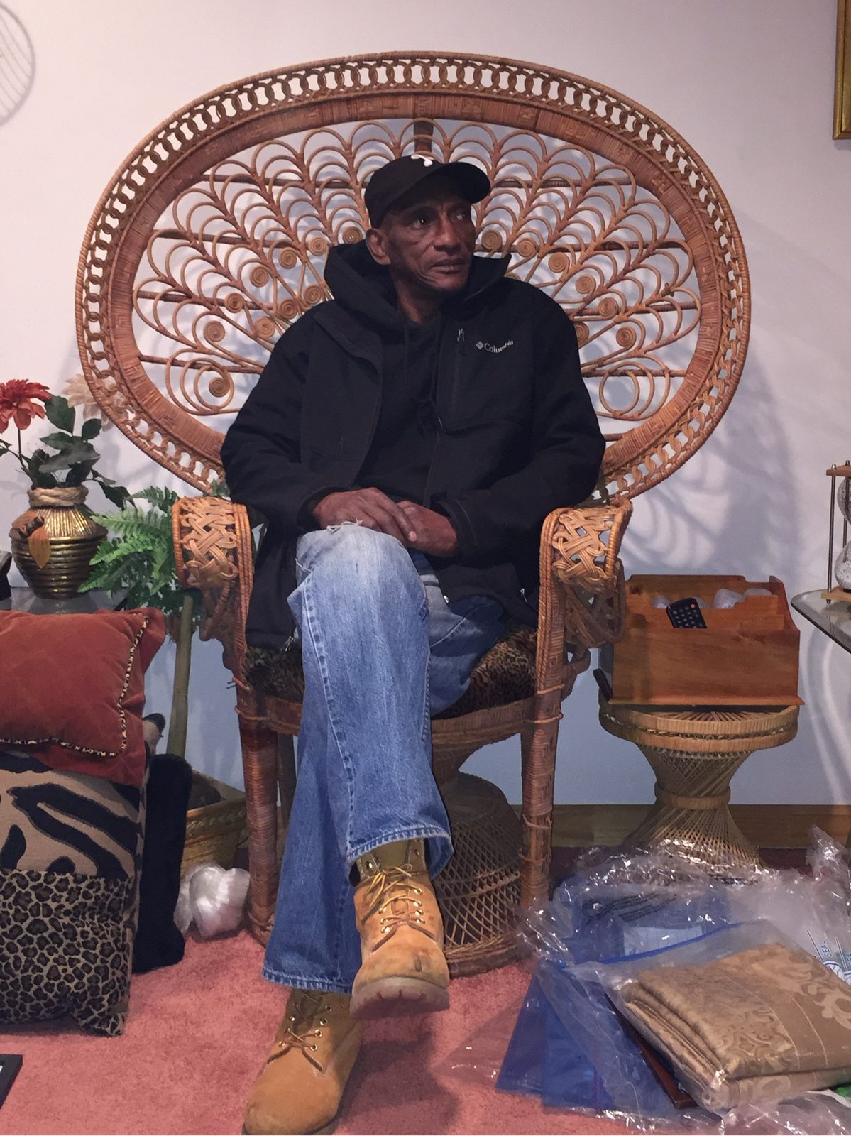 Dad in the wicker peacock chair, later